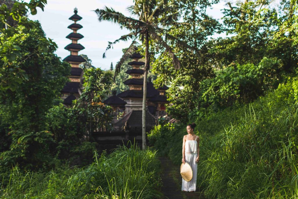 Young beautiful woman walking on Campuhan Ridge way of artists,