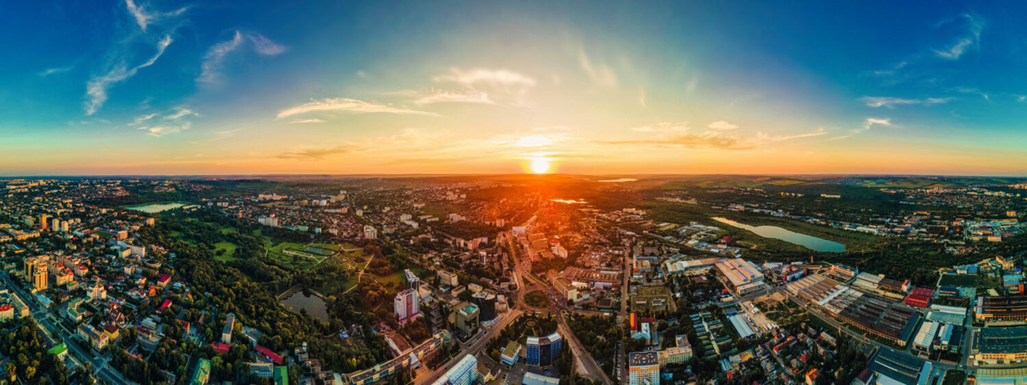 aerial drone view chisinau downtown panorama view multiple buildings roads parks scaled