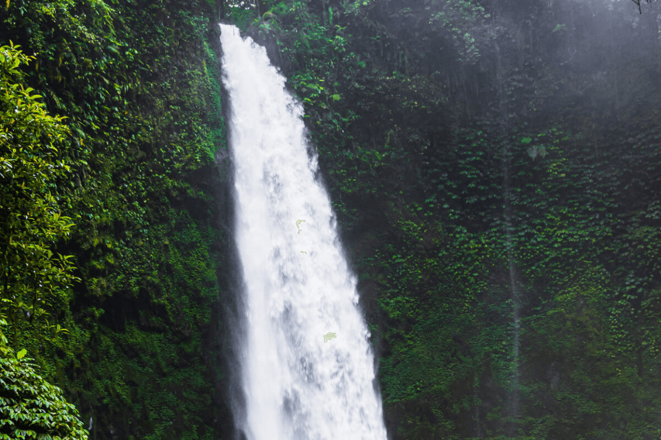 A majestic waterfall cascading down the rocks in Bali during the wet season