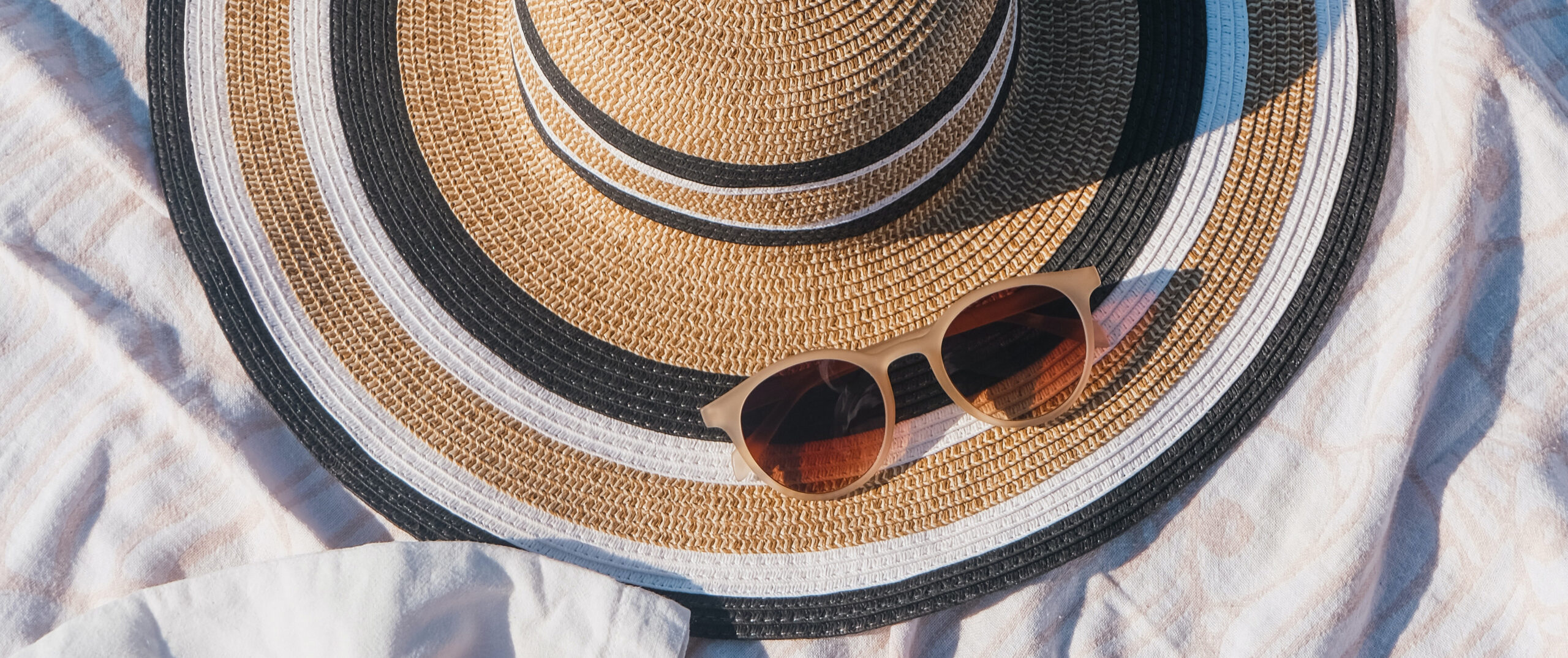 Sunscreen, sunglasses and a sunhat
