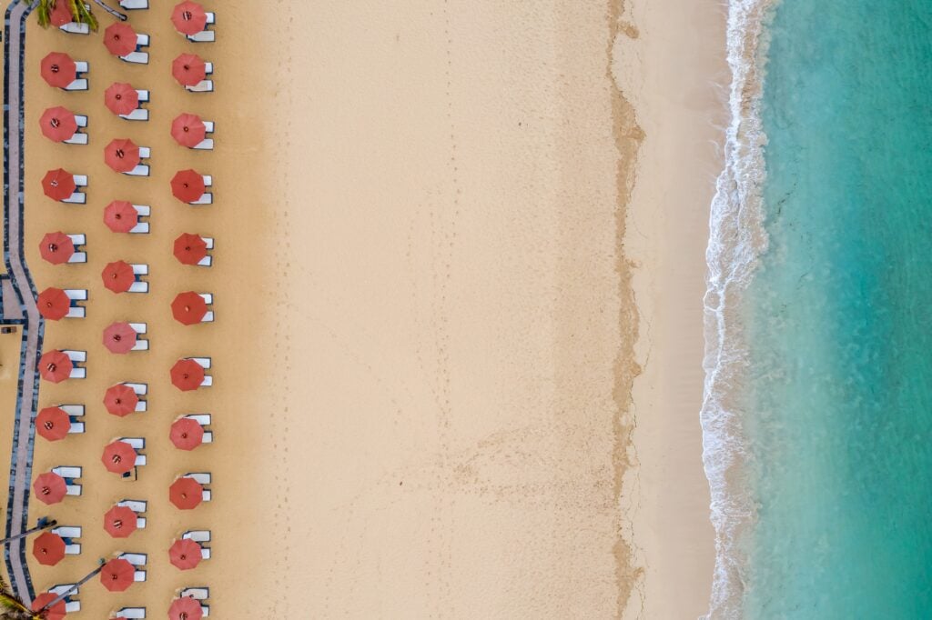 aerial symmetric shot of beach umbrella rows at th 2023 01 19 00 03 04 utc scaled