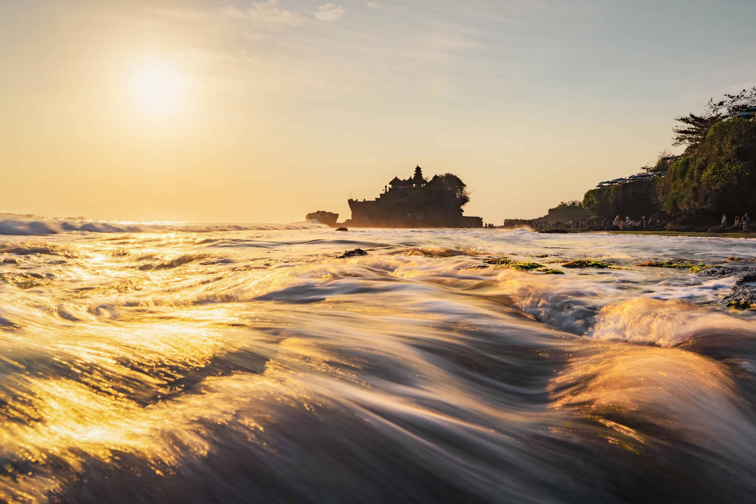 Pura Tanah Lot, the water temple, in Bali at sunset It is one of the most popular of tourist attraction Indonesia Nature landscape background of travel trip and holidays vacation in Indonesia