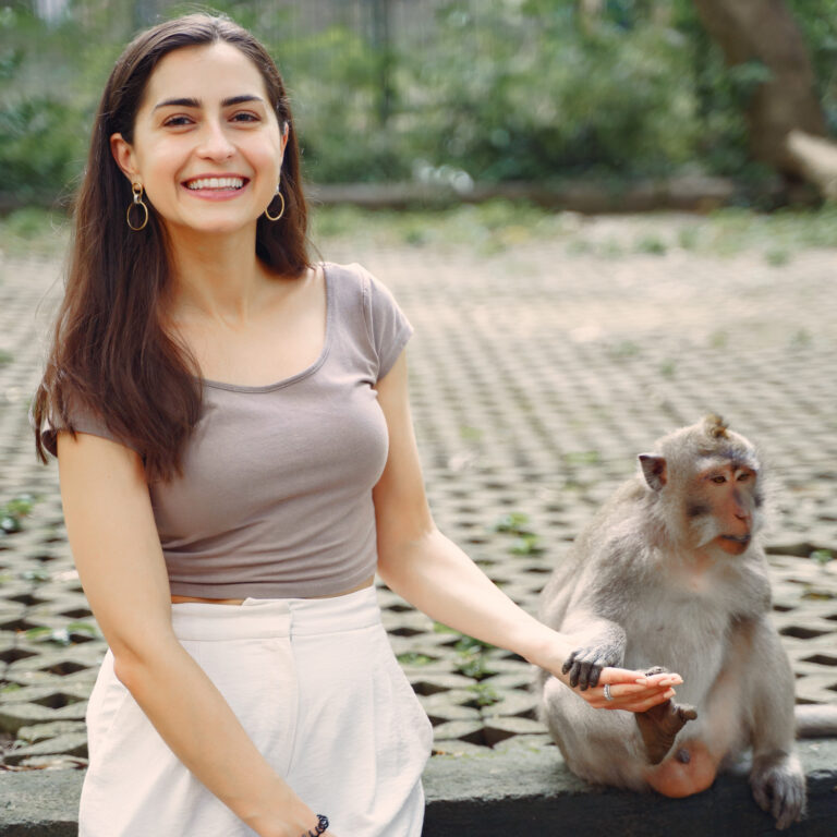 woman on vacation playing with a monkey 2021 08 29 09 40 31