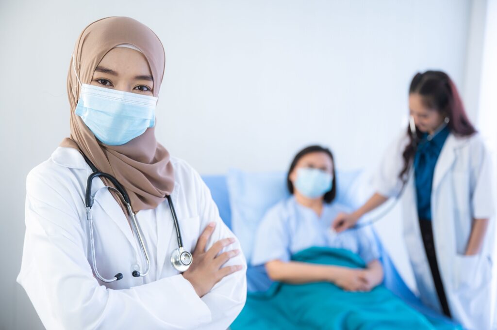 muslim asian woman doctor, Professional muslim doctor working in hospital, healthcare and medicine