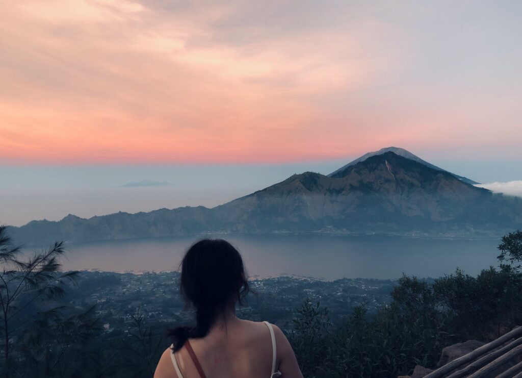 a girl in Kintamani watching sunset