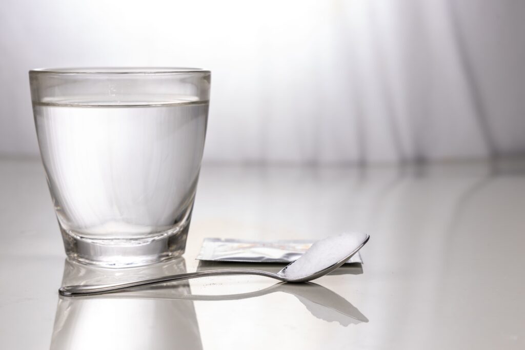 ORS or oral rehydration salt with glass of water, sachet and spo