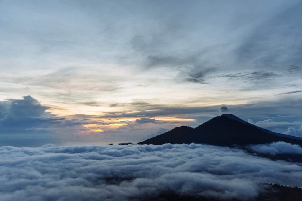 Active Indonesian volcano Batur in the tropical island Bali. Indonesia. Batur volcano sunrise serenity. Dawn sky at morning in mountain. Serenity of mountain landscape, travel concept
