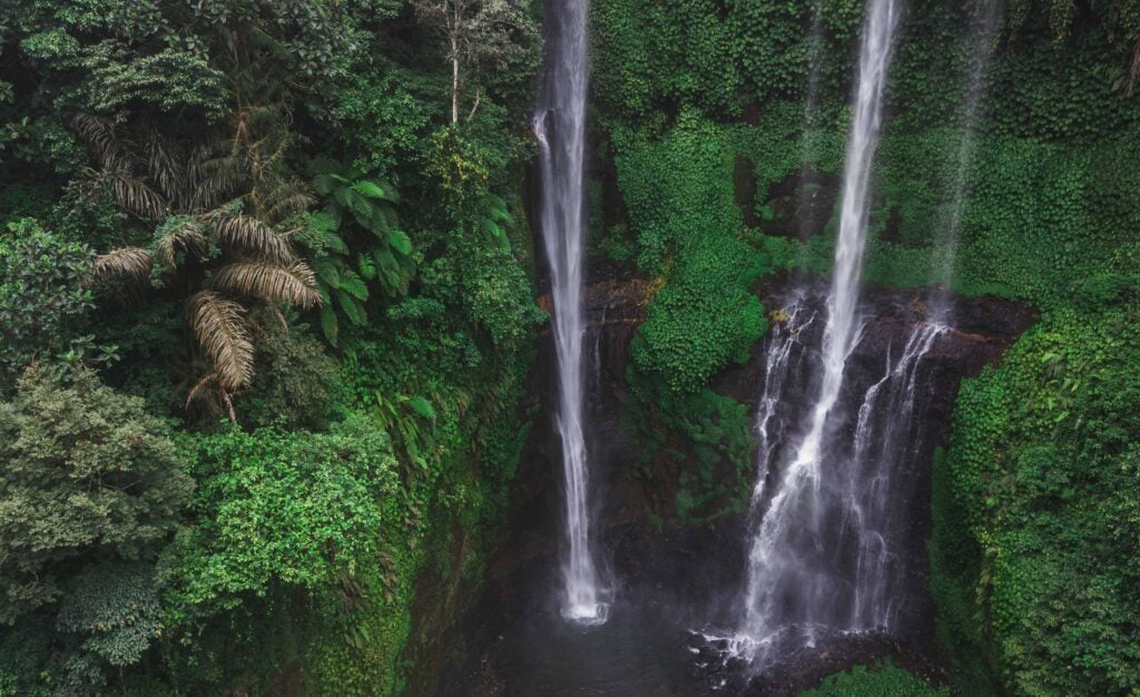 Aerial view of famous Sekumpul waterfalls in Bali, Indonesia. Tr