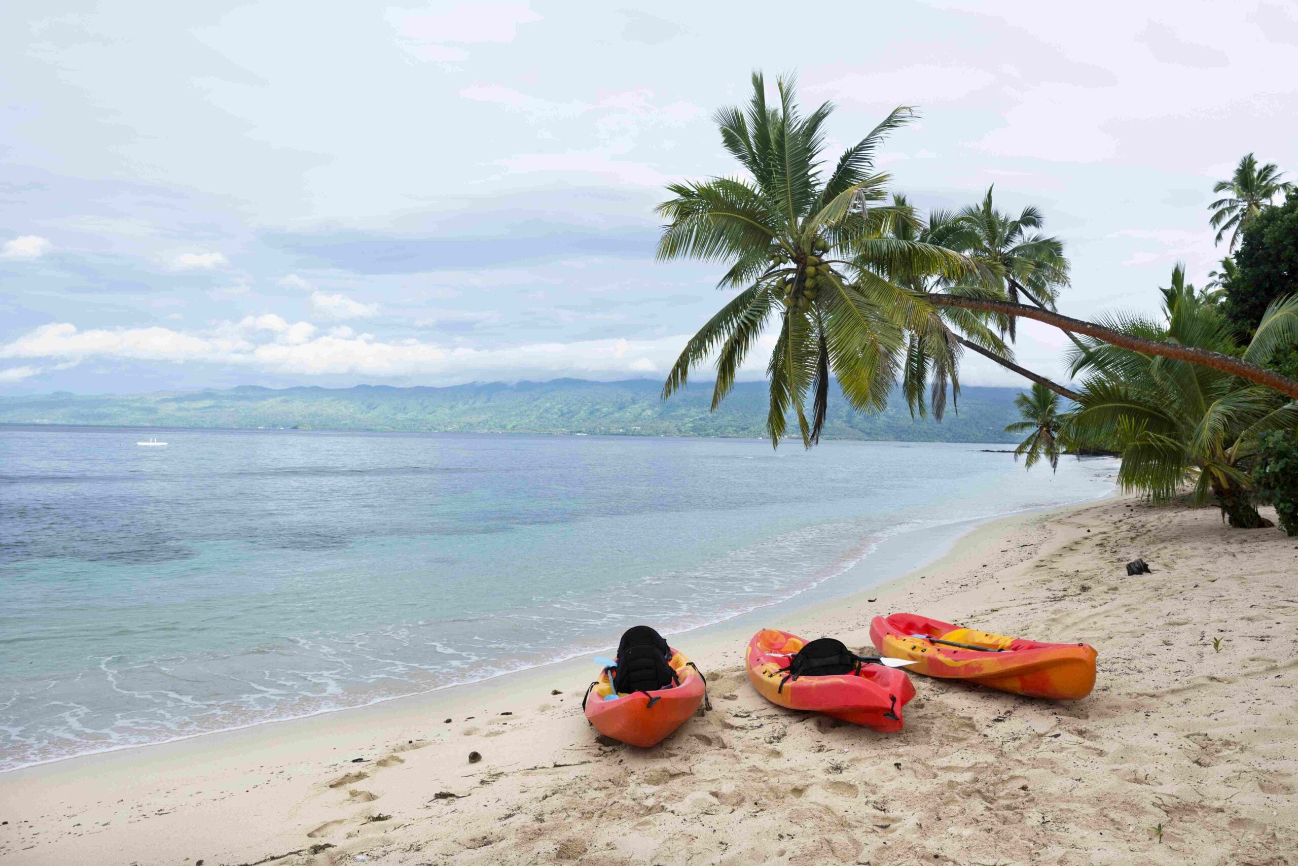 Kayaks on tropical beach