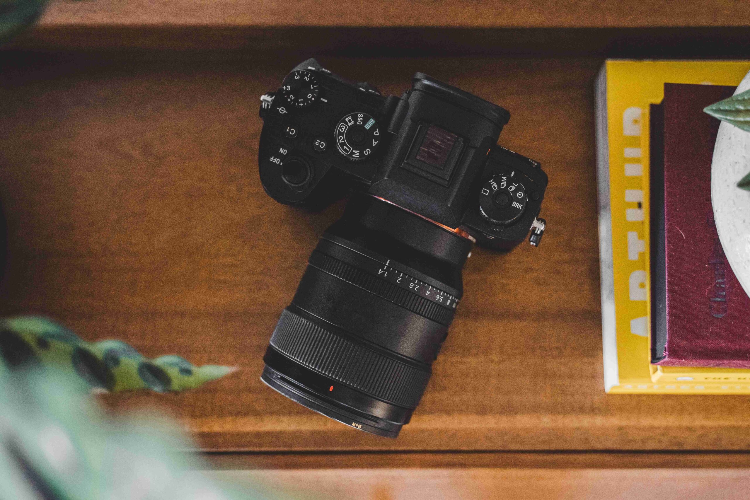 mirrorless digital camera on desk overhead view bali packing list