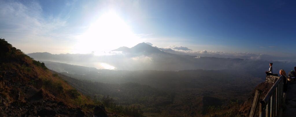 people at the top of mount batur in bali indonesia