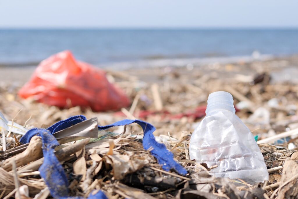 plastic waste and trash on sandy beach environmen 2023 11 27 04 56 11 utc