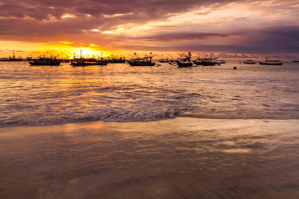 Sunset on the beach of Jimbaran. Bali