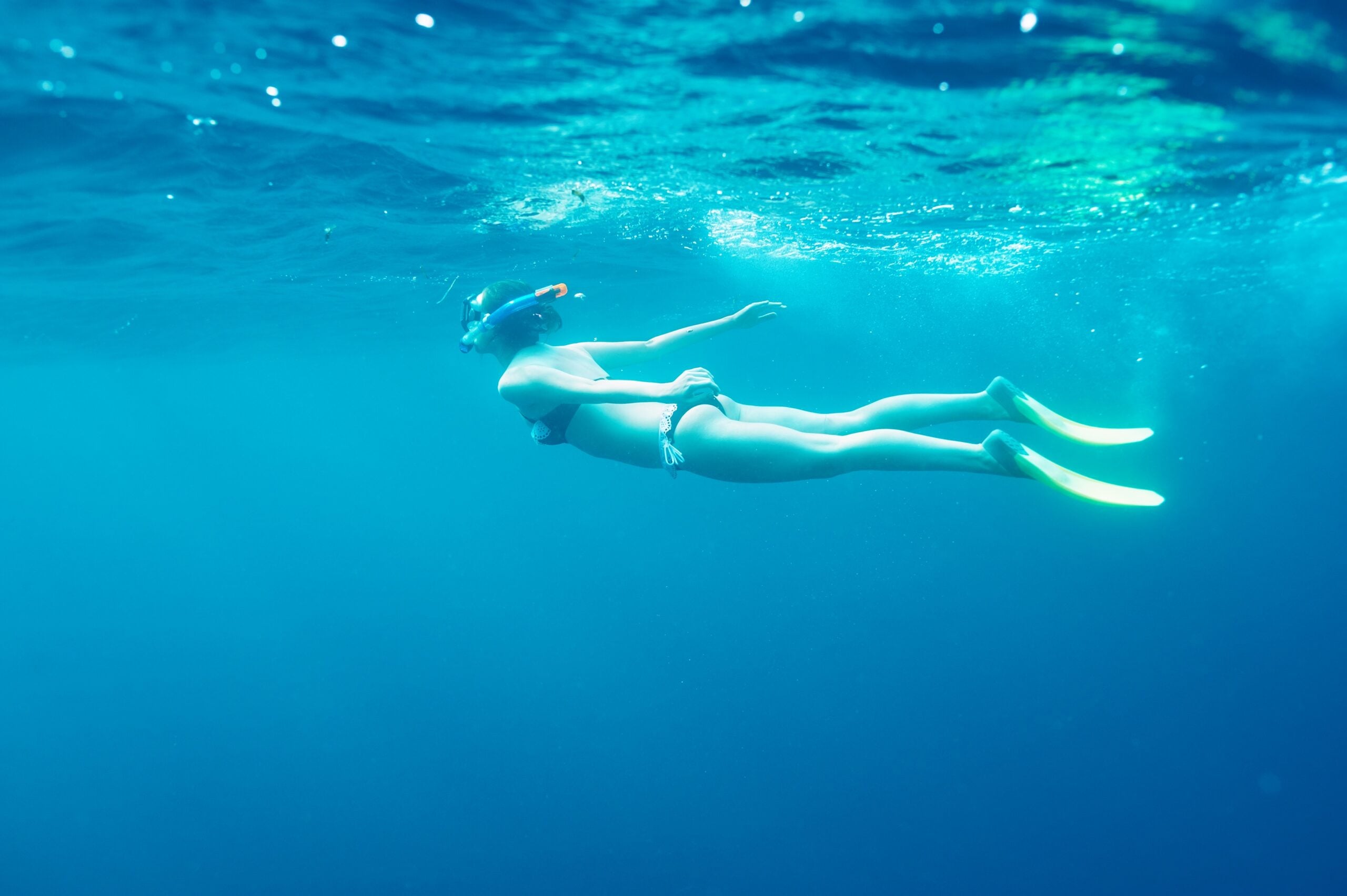 Woman with mask snorkeling