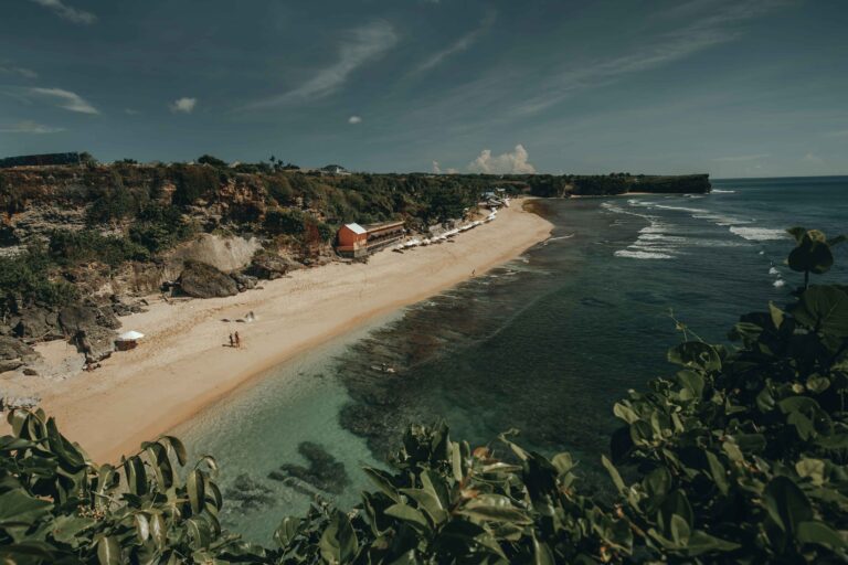 Amazing aerial Bali beach coast at ocean waves crashing to sand Tropical paradise Indonesia island