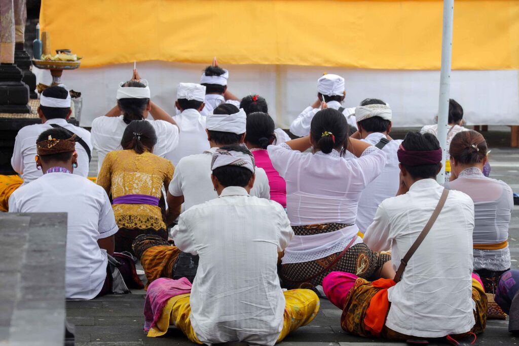 balinese people praying together 2023 11 27 05 10 30 utc