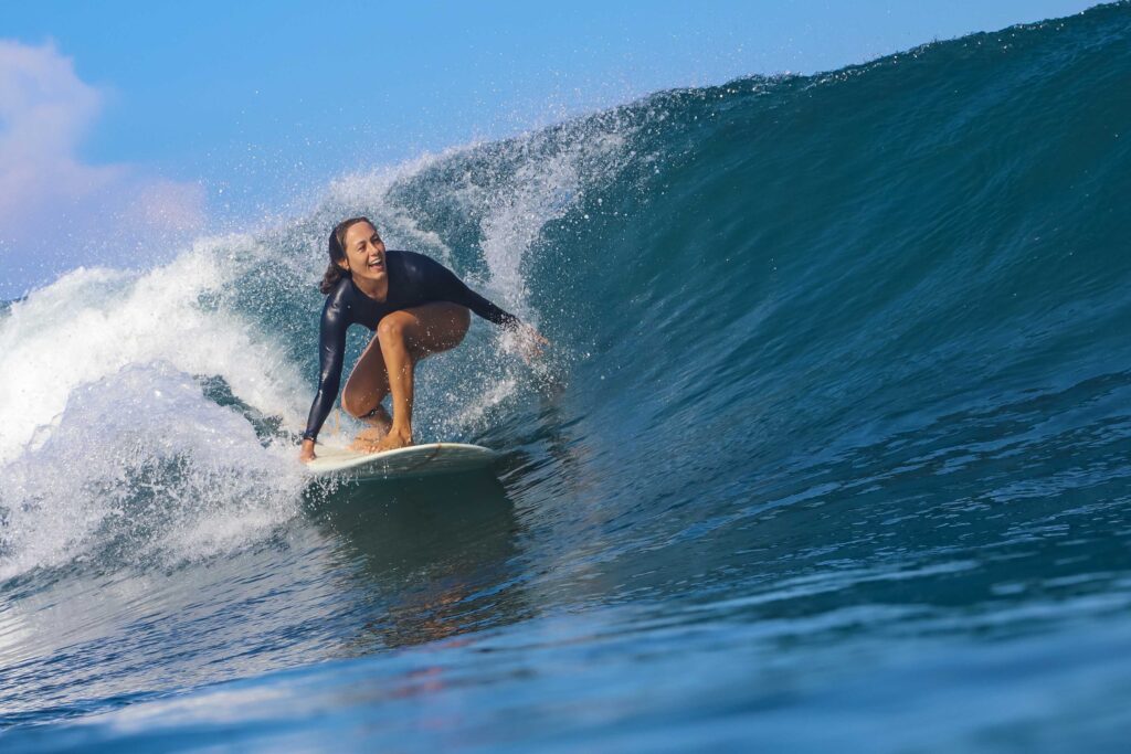 Female surfer on a wave