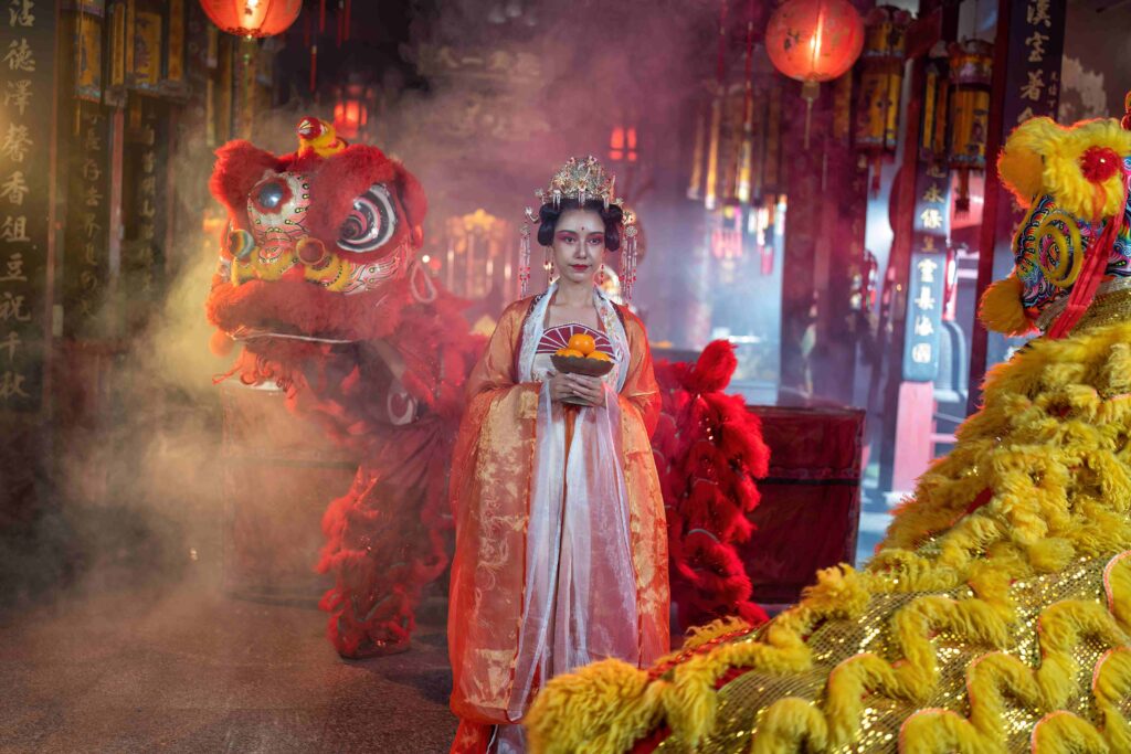 Girl in Chinese traditional dress in temple translation language is 'lucky and prosperity for all'