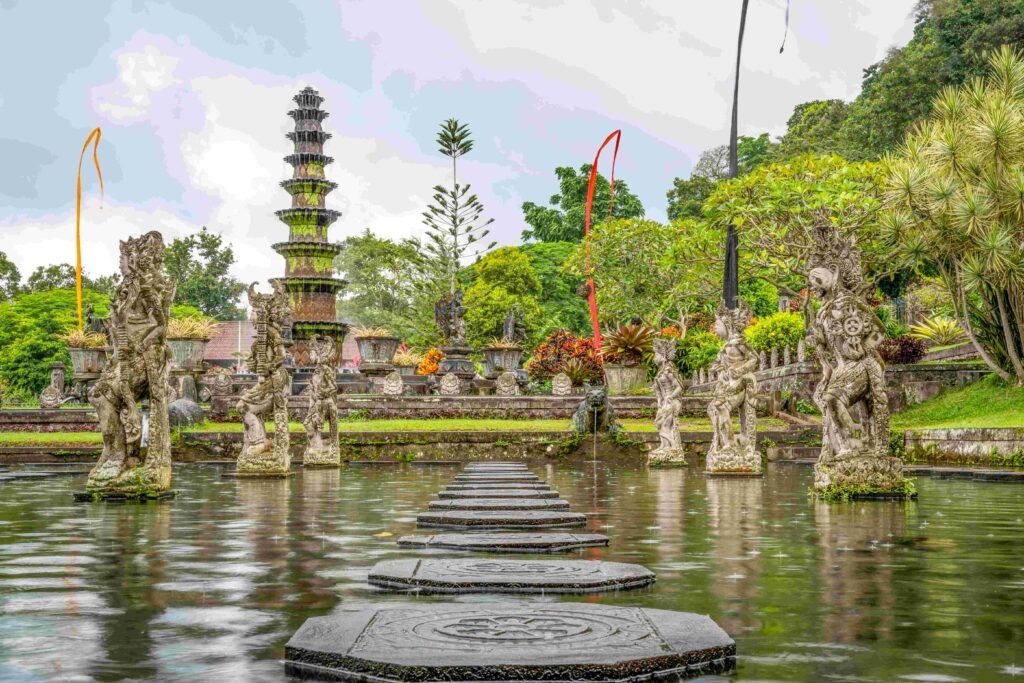 Gorgeous shot of Tirta Gangga in Indonesia, showing a beautiful lake, surreal garden and statues