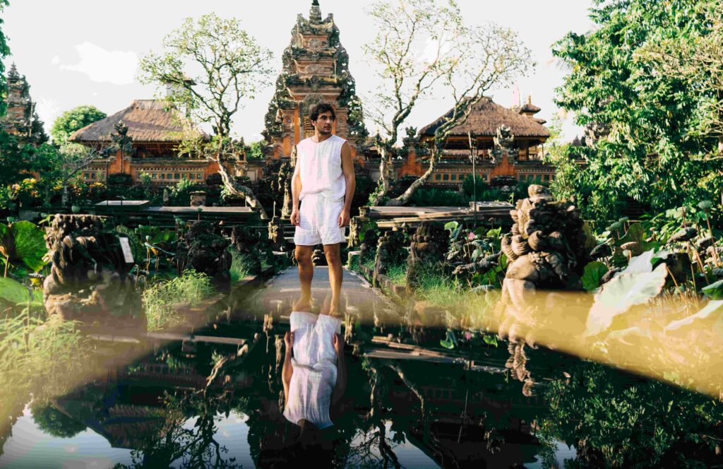 Man admiring views near oriental temple in Bali