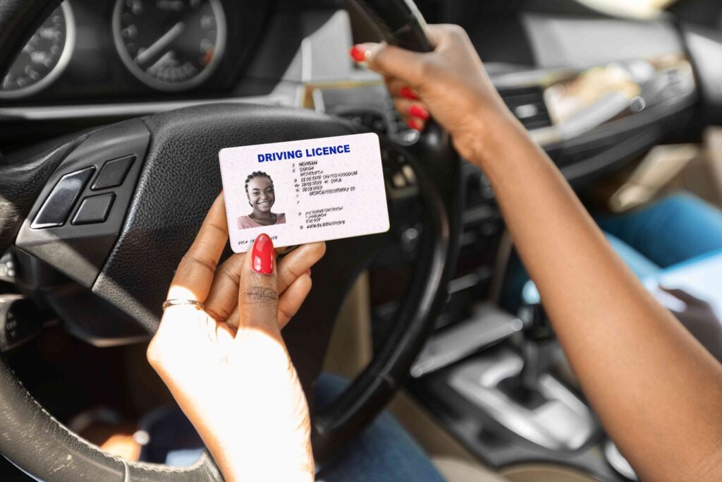 Newest driving license in black lady hands, closeup