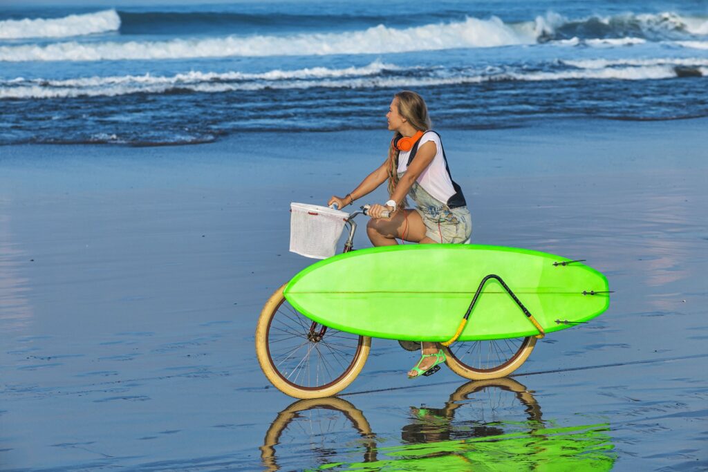 Young woman with surfboard at beach