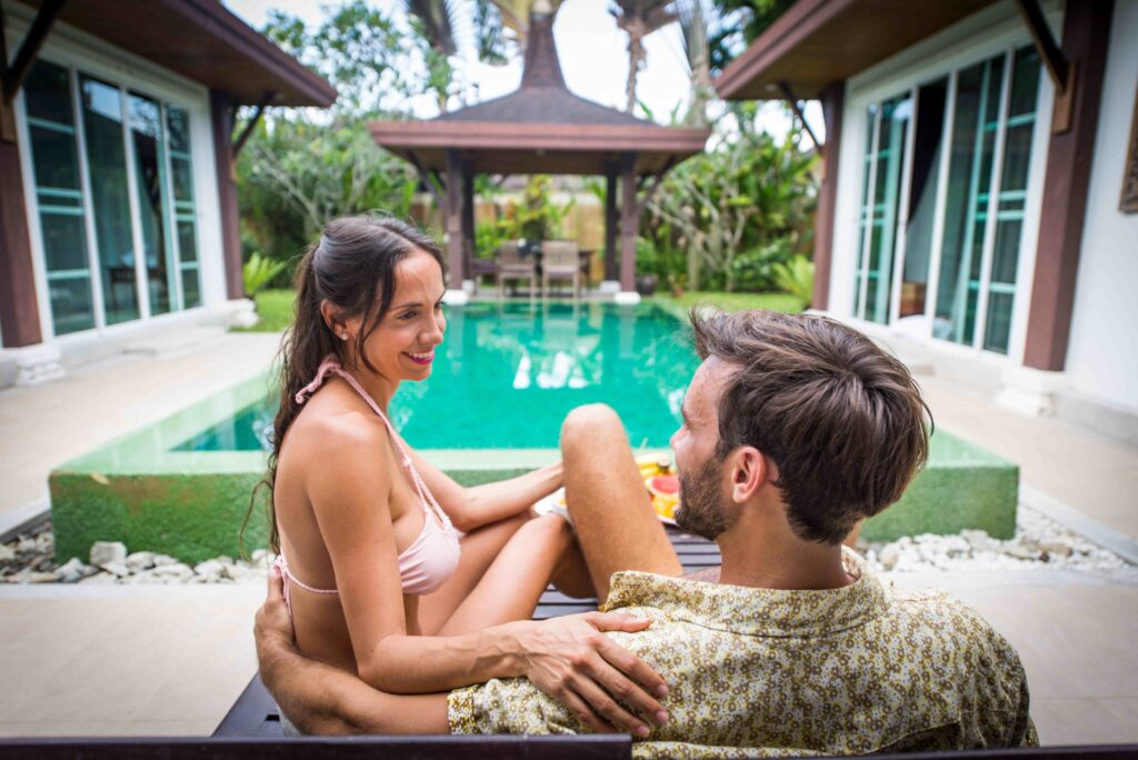 Couple of lovers in a beautiful villa with swimming pool