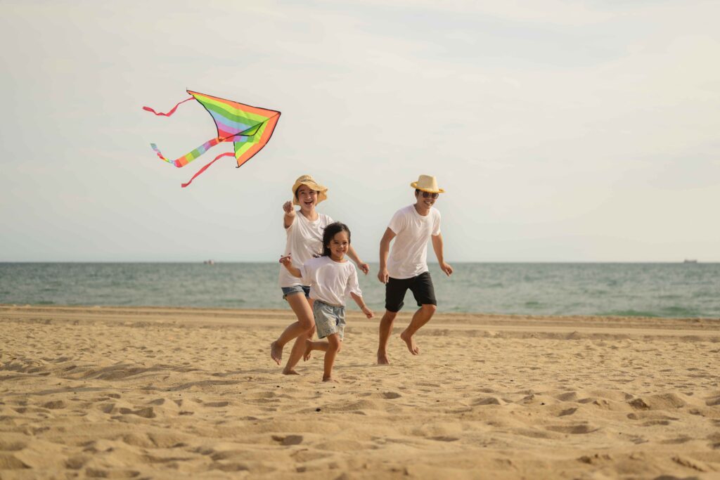 Happy family having fun on beach, Family travel on summer vacation