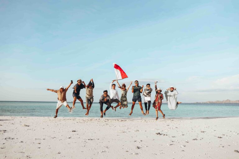 indonesian people jumping together on the beach 2023 11 27 05 16 53 utc