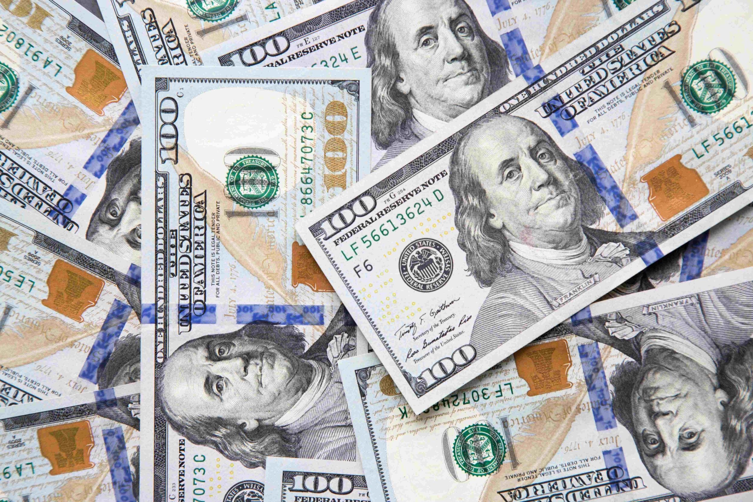 top view of the scattered hundred dollar bills 2023 11 27 04 53 59 utc