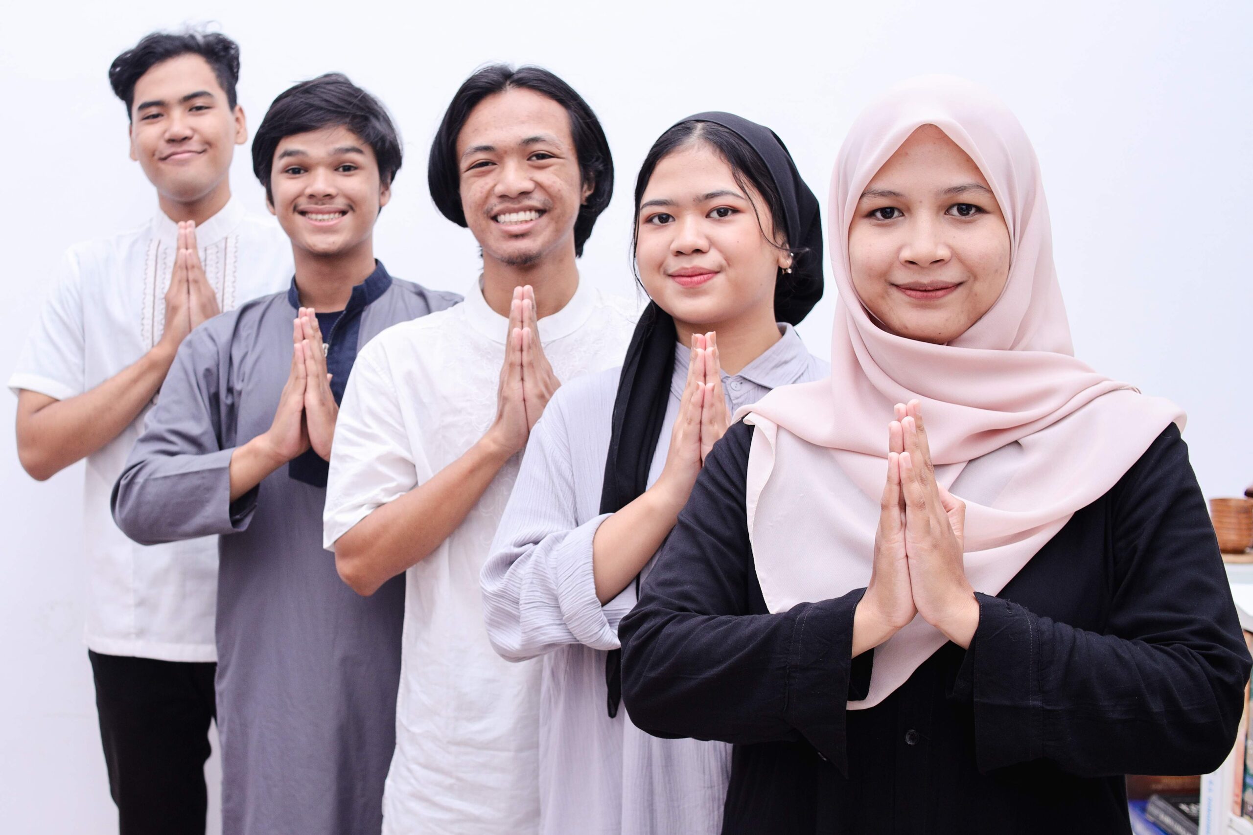 young muslim people showing greeting gesture and s 2023 11 27 05 09 48 utc