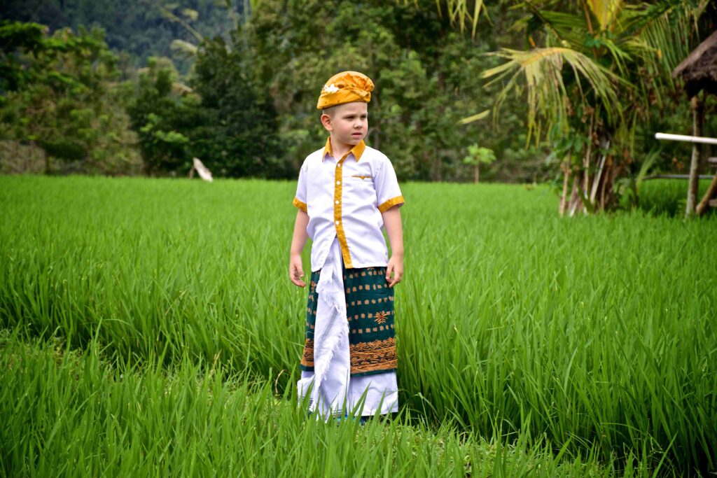 a european boy in traditional balinese clothing st 2023 11 27 05 08 53 utc