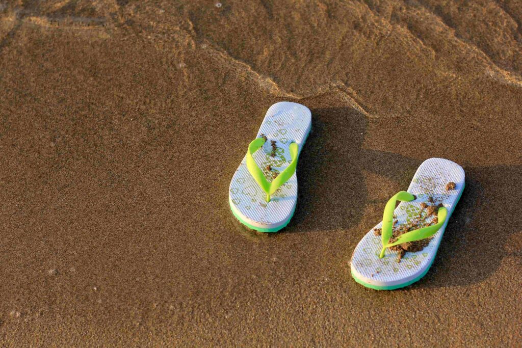 flip flops on a sandy sea beach summer concept of 2023 11 27 05 24 15 utc