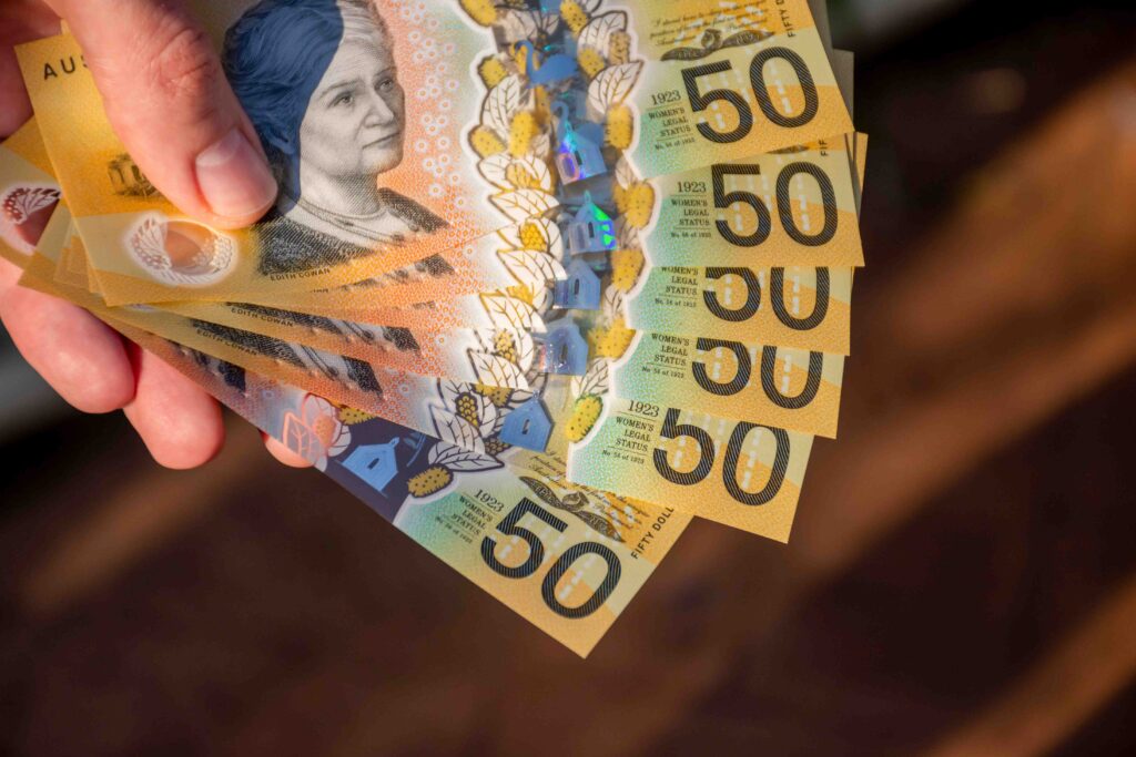 Hands holding australian dollars 50 banknotes Finance and payment concept