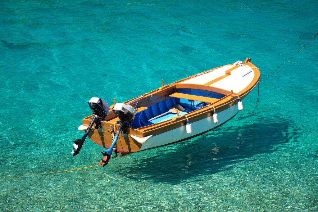 High angle view of wooden boat on turquise clear sea