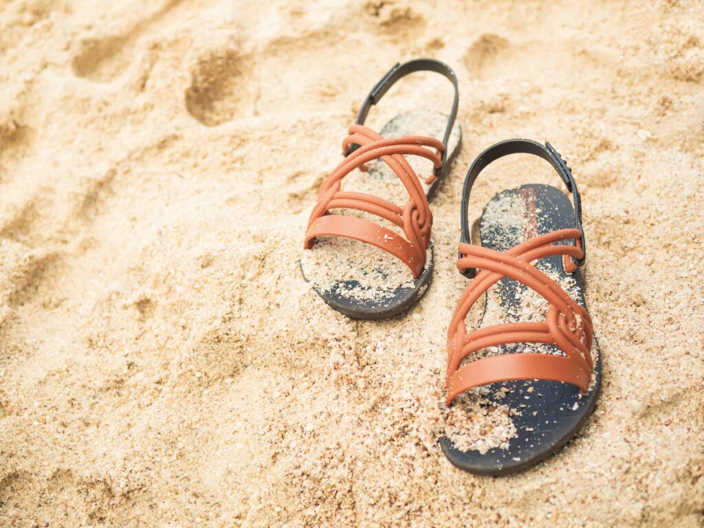 sandals on beach background accessories summer vac 2023 11 27 05 05 15 utc