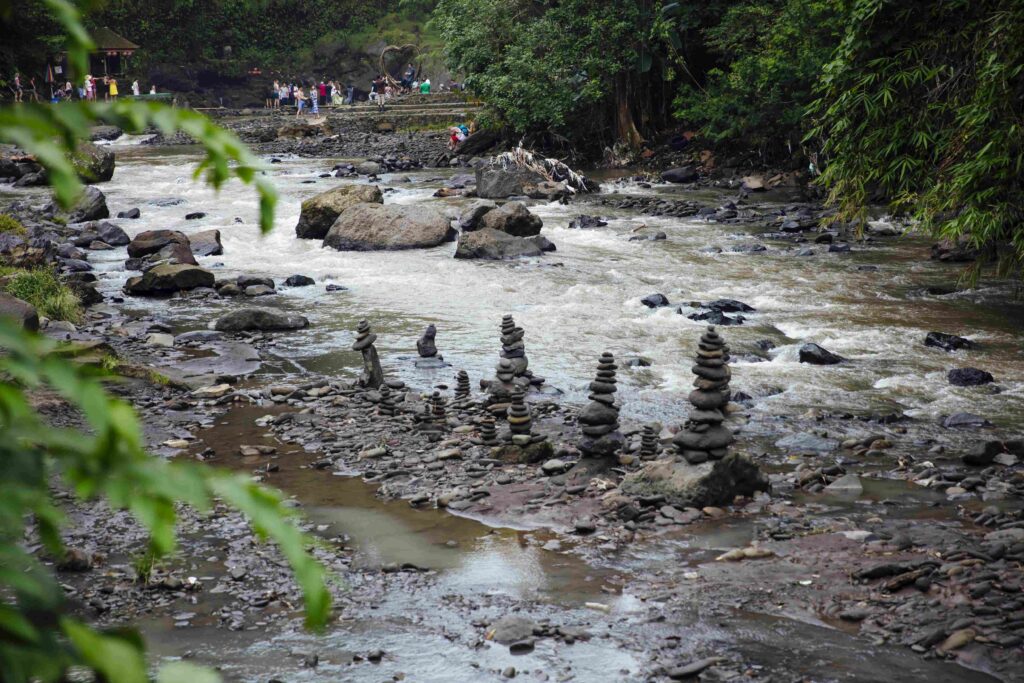 Stacked zen stones at Tegenungan Waterfall at Bali, Indonesia