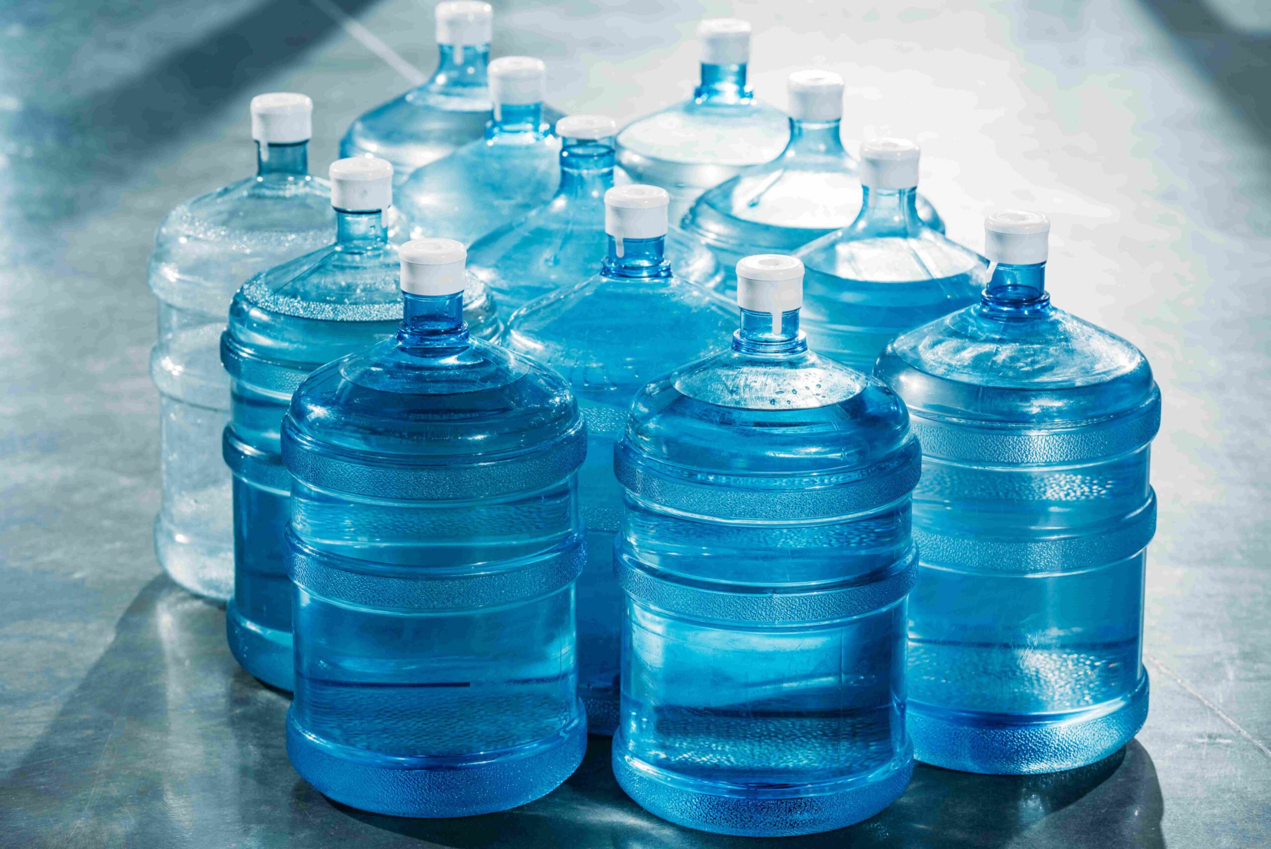 Delivery concept with large blue water bottles