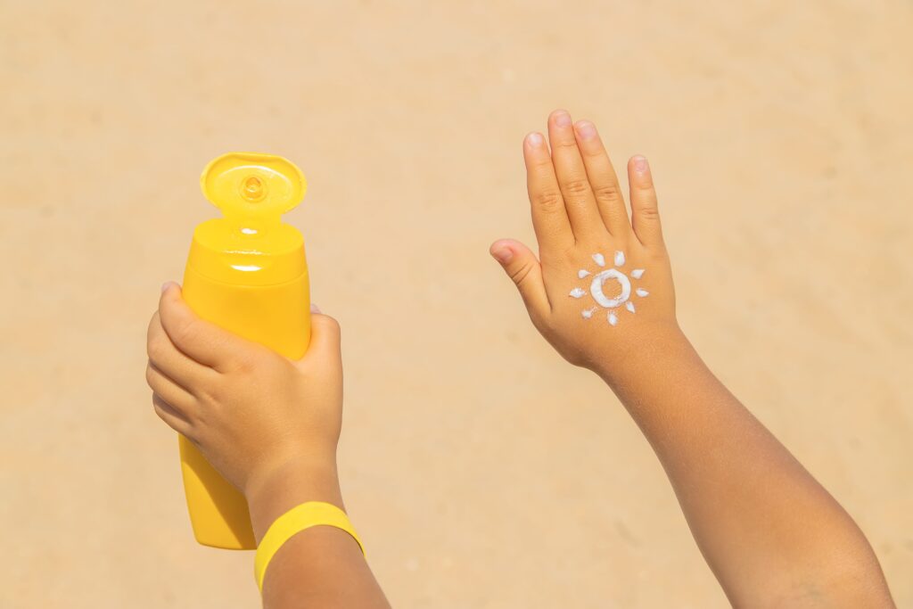 Sunscreen on the skin of a child Selective focus