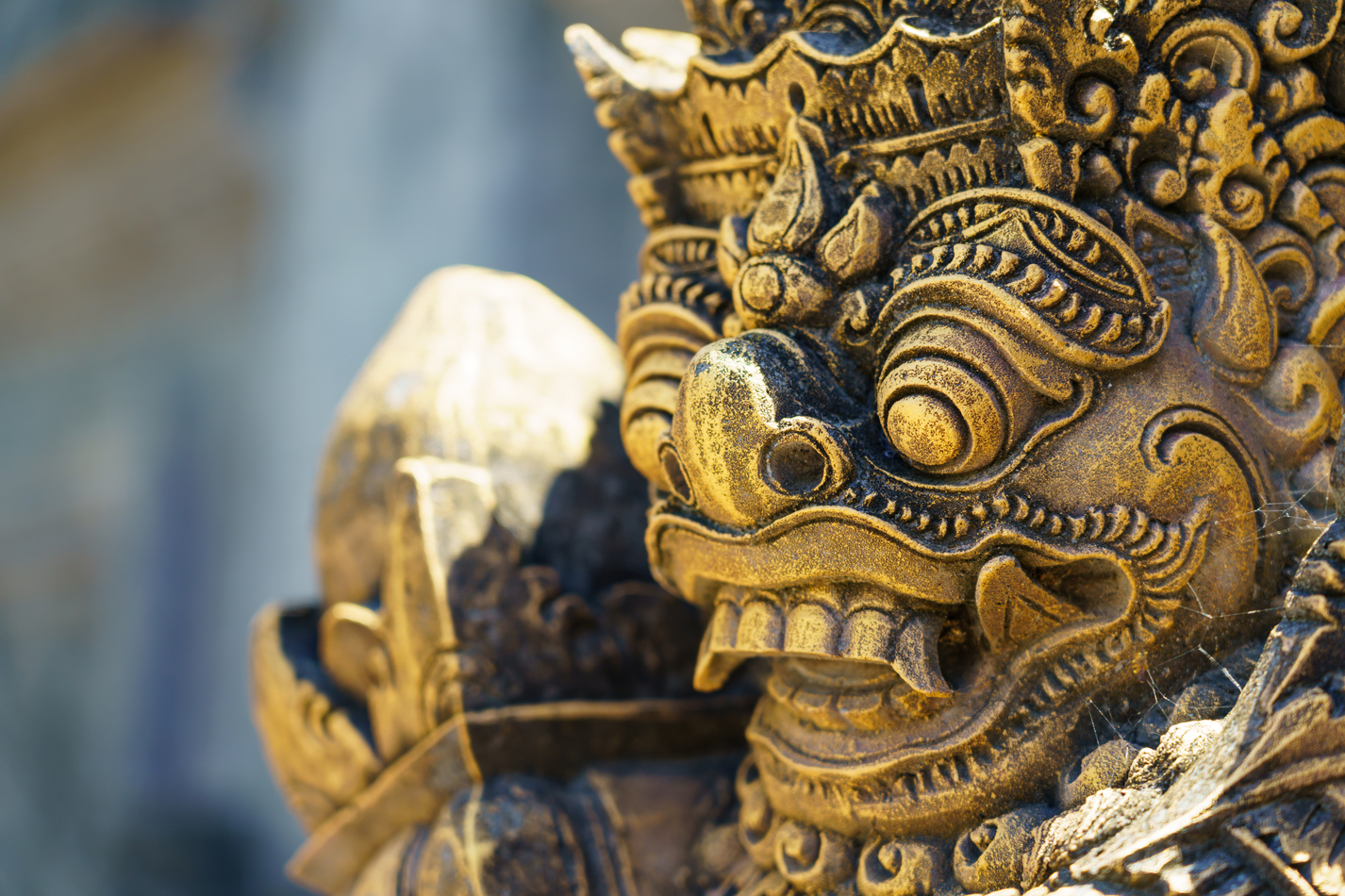 Ancient Balinese statue at the temple in Bali