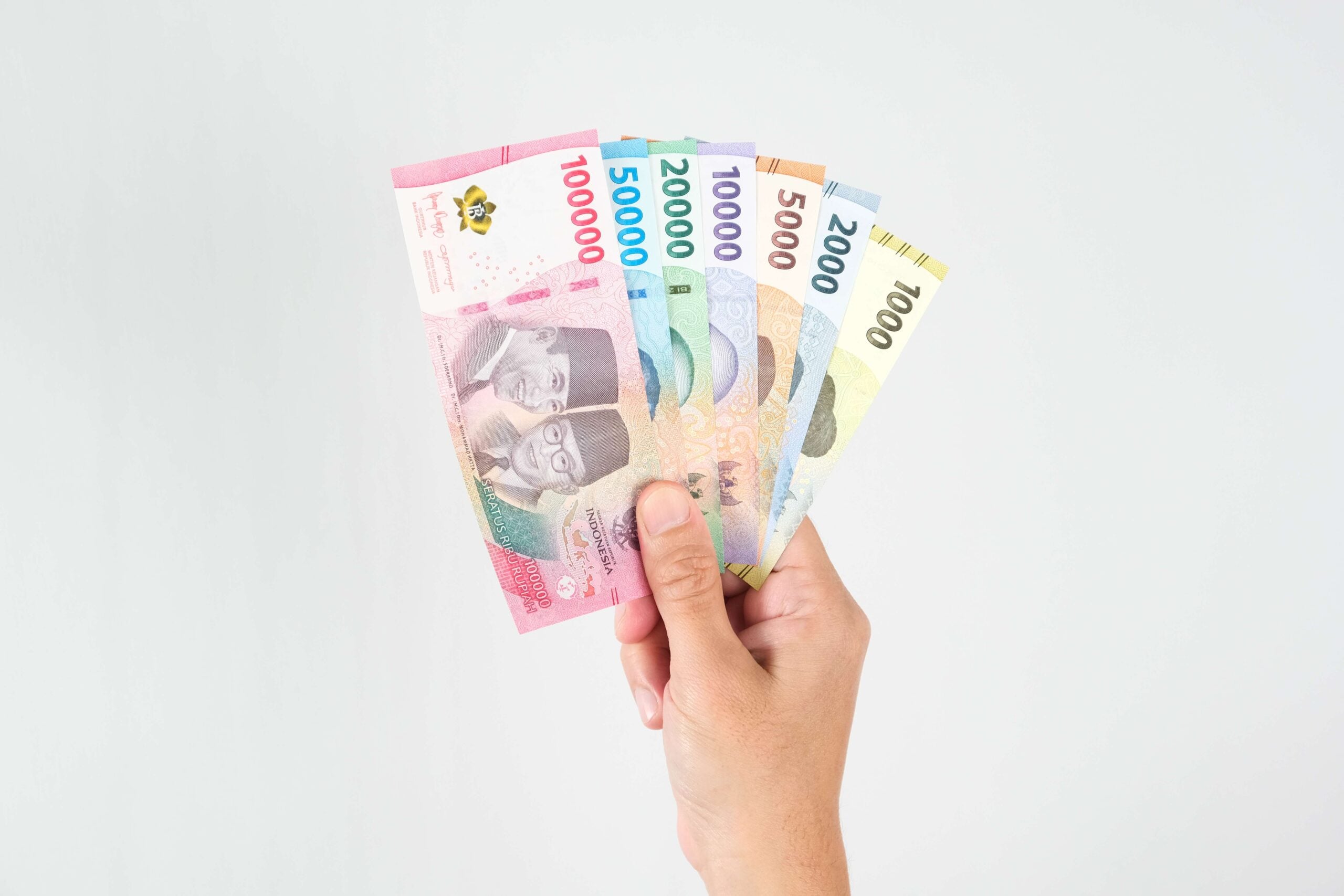hand holding rupiah 2023 11 27 04 49 19 utc