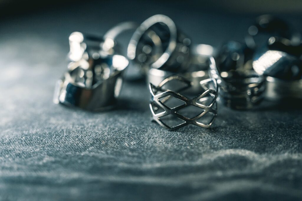 Closeup shot of a pile of vintage silver decorative rings