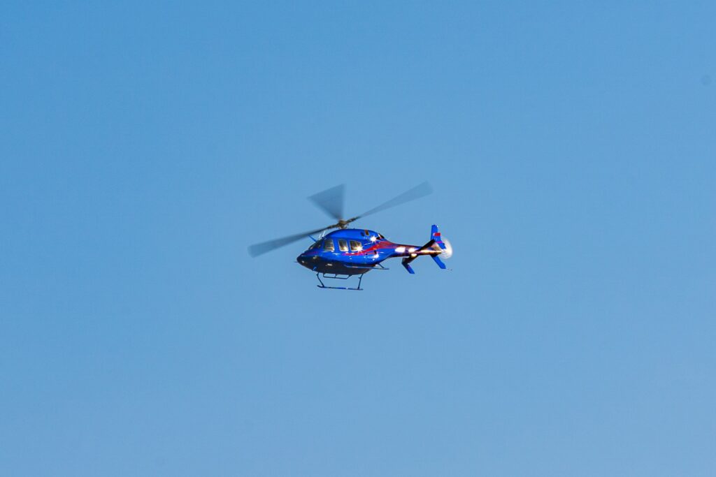 Helicopter flying in the sky during a sunny day