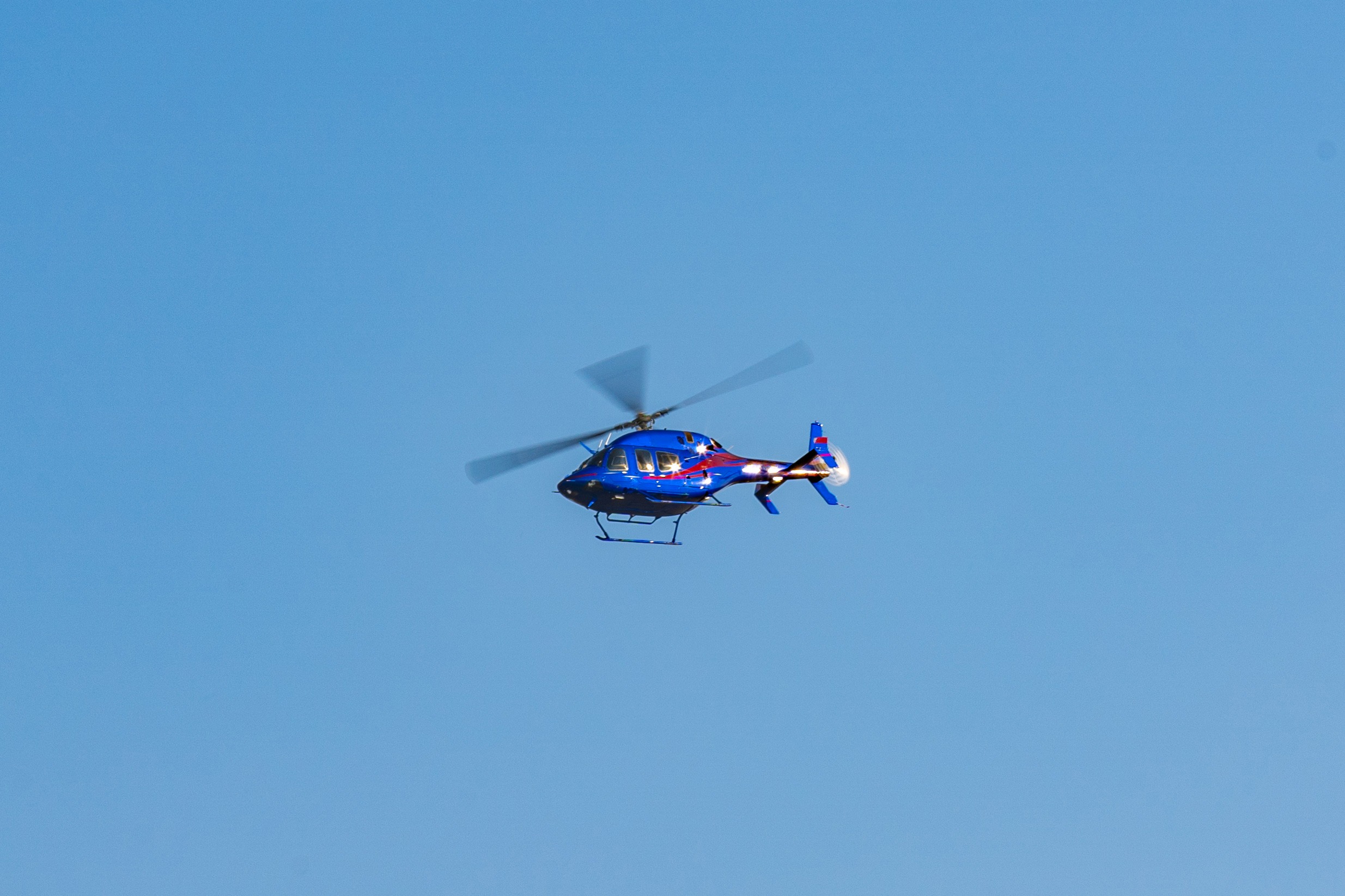 Helicopter flying in the sky during a sunny day