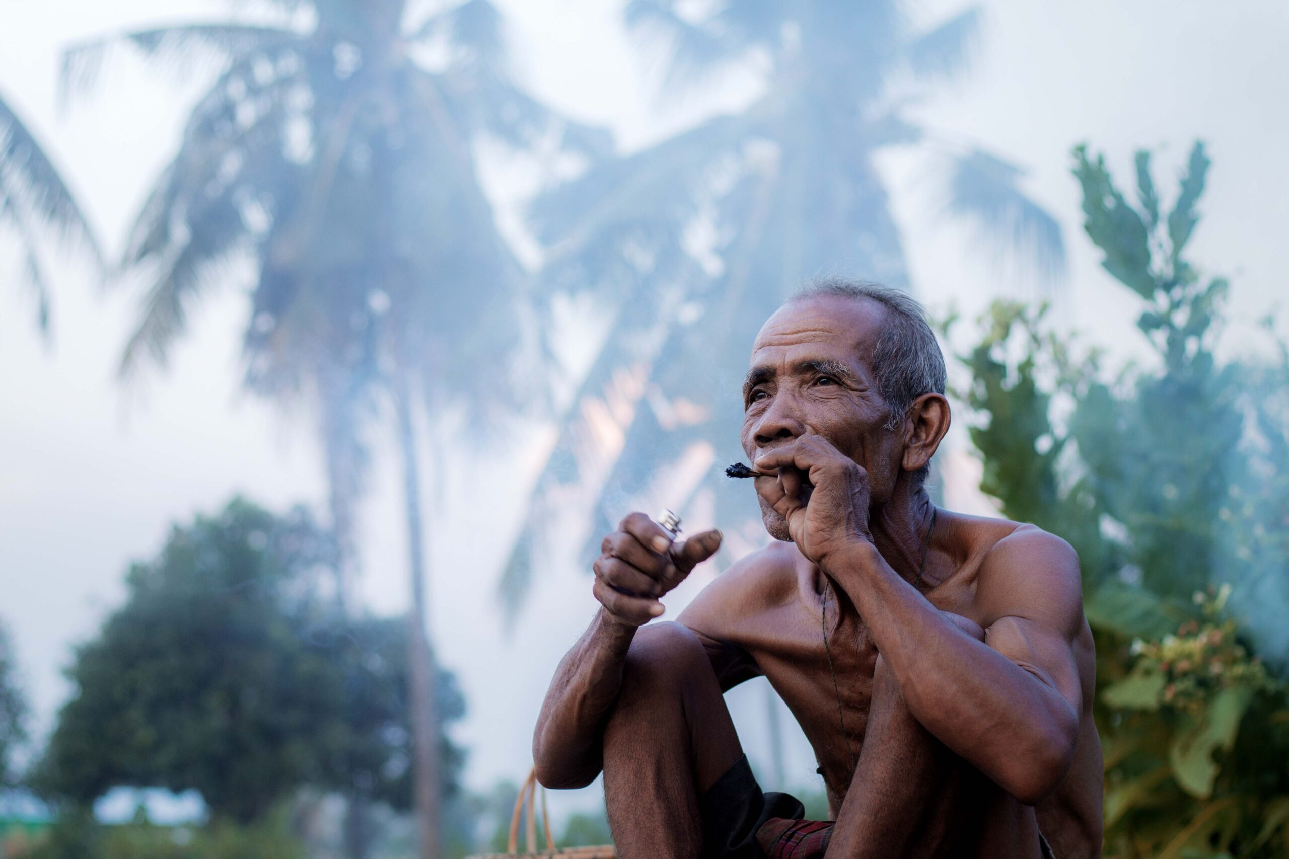 Old man are smoking on field