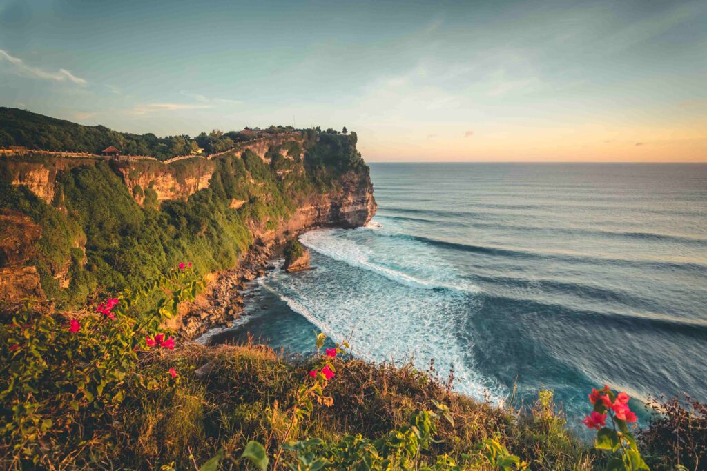 Overview panorama ocean shore, cliff Sunset Bali