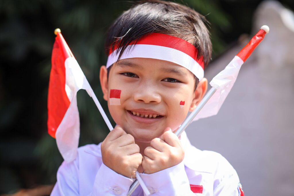 adorable young boy with indonesian flag face paint 2023 11 27 05 27 38 utc