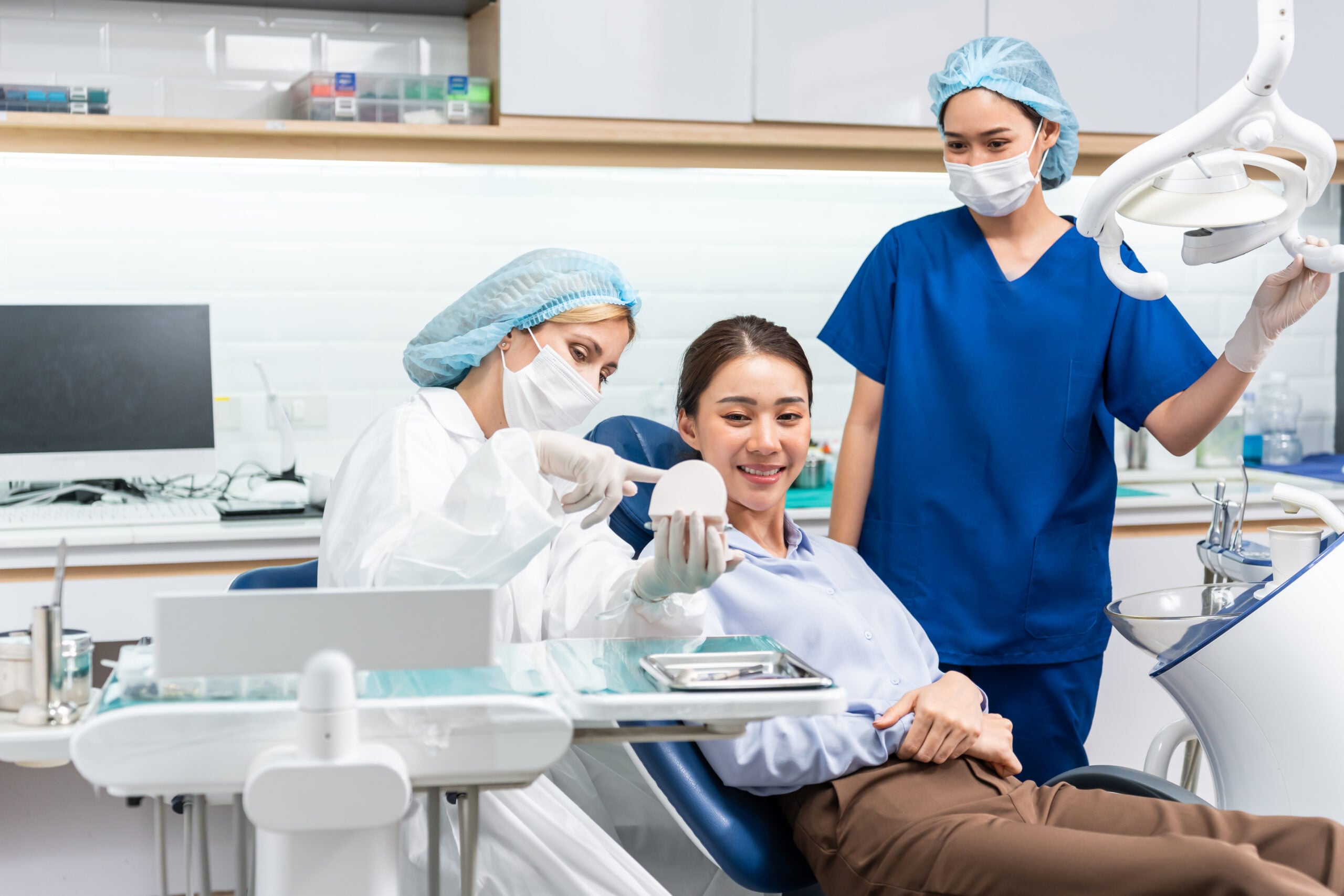 caucasian dentist examine tooth for young girl at 2023 11 27 05 26 50 utc