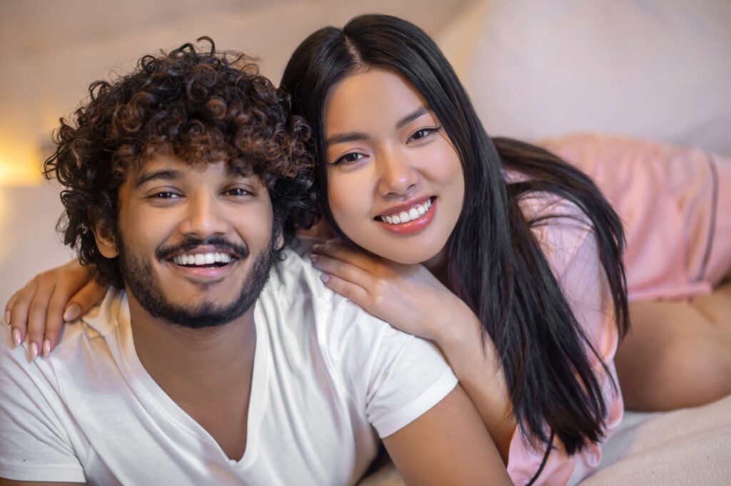 Close up man and woman smiling at camera