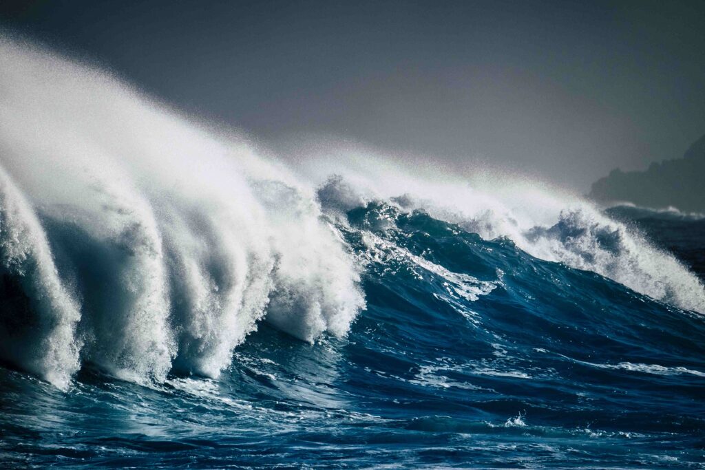 Dangerous powerful energy wave big splash white foam and blue de